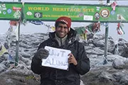 Aly Madhavji at the top of Kilimanjaro