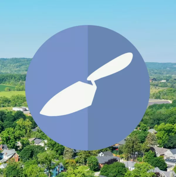 trowel over aerial view of sky and trees
