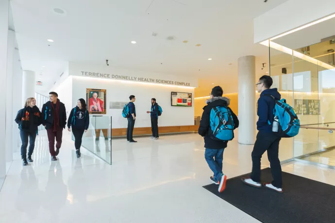 students walking in atrium at TDHSC