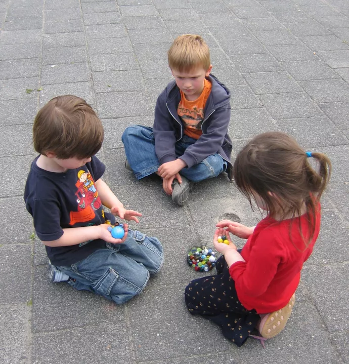 Children playing marbles