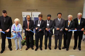 Honorable guests including Professor Deep Saini all in line cutting the ribbon.