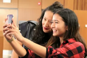 two women posing for a selfie photo