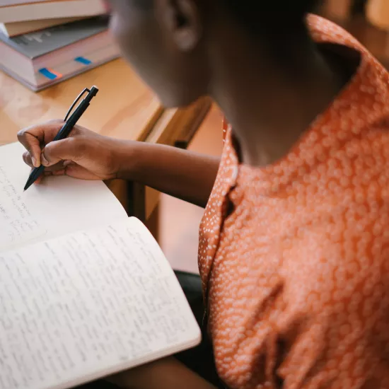 woman writing in a notebook