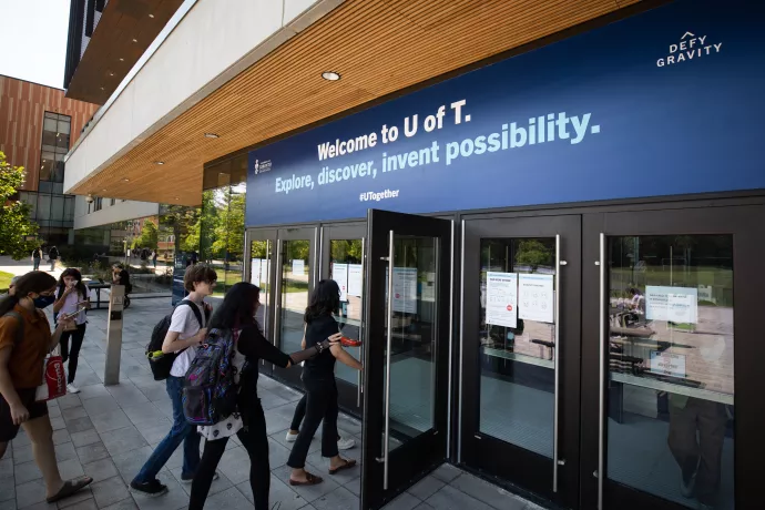 Students entering through doors to go to their classes on the first day of school