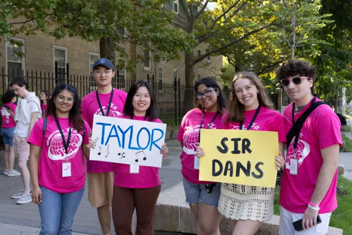 students holding signs at move-in day