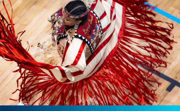 Twirling dancer with red and white traditional garb