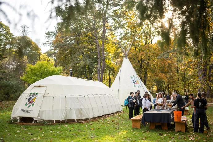 Conference-goers outside Teaching Lodge