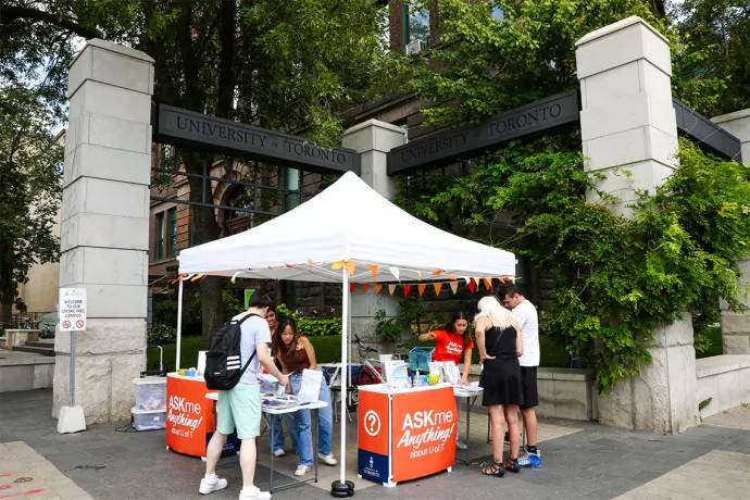 Students at an "Ask me Anything" booth on the St. George campus