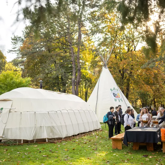 Conference-goers outside Teaching Lodge