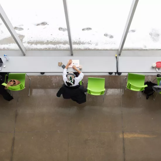 Overhead of students sitting at a desk